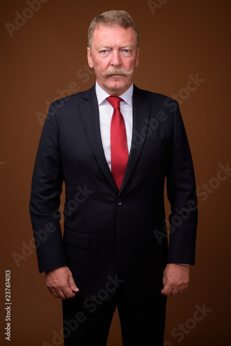 Handsome senior businessman wearing suit and tie