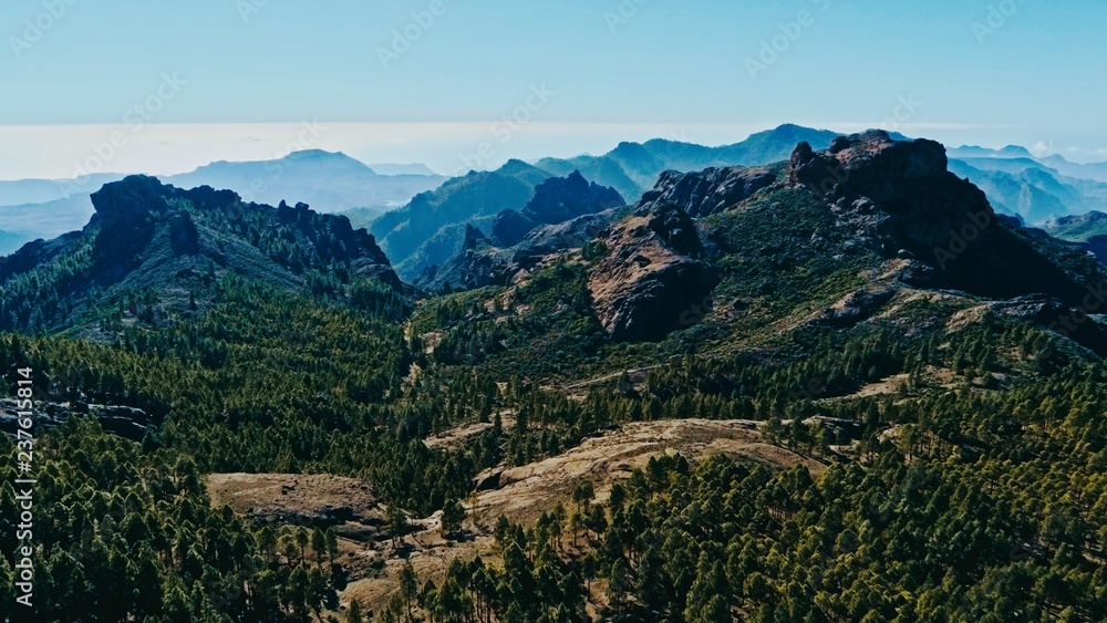 aerial drone image of beautiful stunning landscape view off the Roque Nublo track at Gran Canaria Spain with a valleys and many small peaks on a sunny day