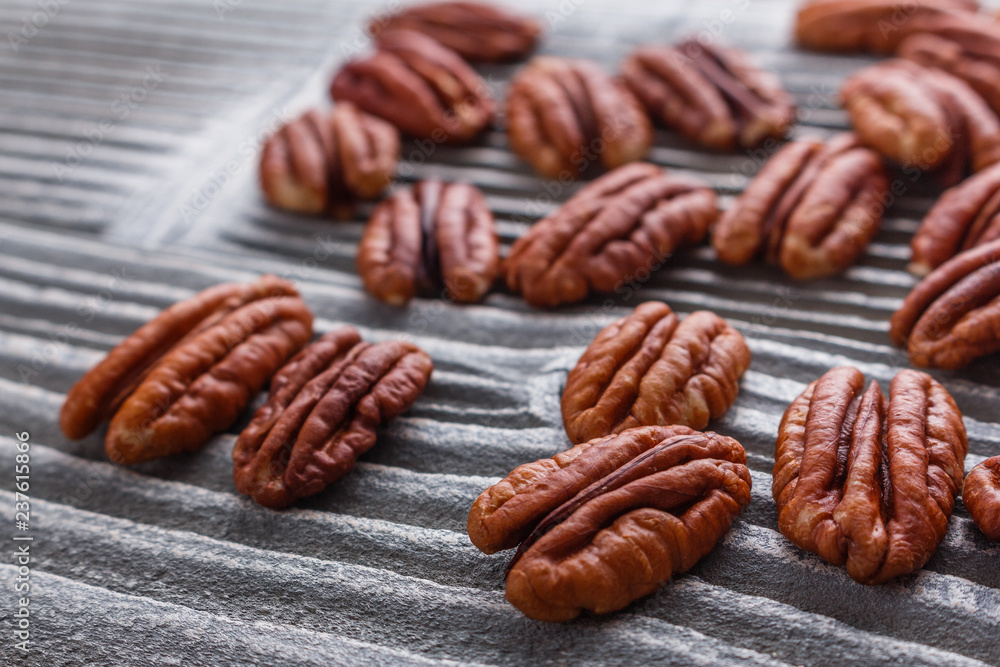 delicious pecan nuts on a rustic wooden background delicious pecan nuts on a rustic wooden background