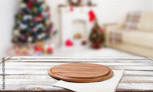 cutting desk,white napkin on wooden table on blurred holiday interior, new year and christmas concept, tablecloths