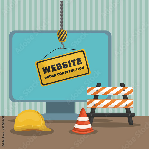 website under construction with desktop computer © djvstock