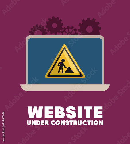website under construction with laptop
