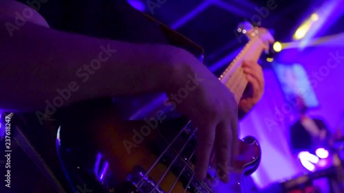 Bass Player Jamming at a Concert on Stage