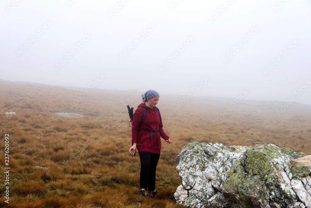 Woman hiker on the mountain enjoying