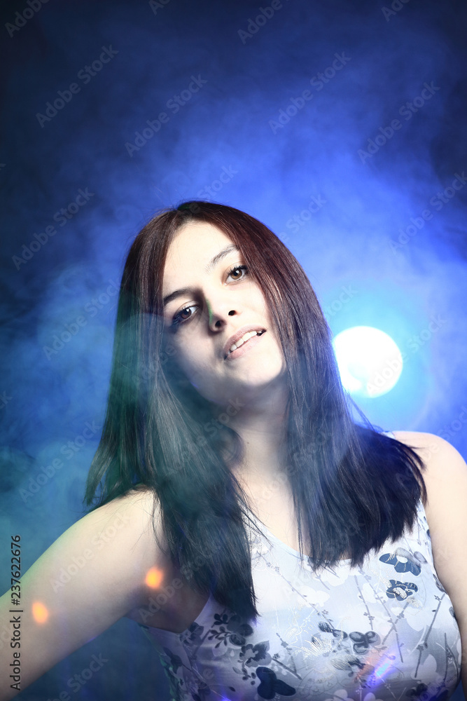 young woman in casual clothes posing in front of camera young woman in casual clothes posing in front of camera