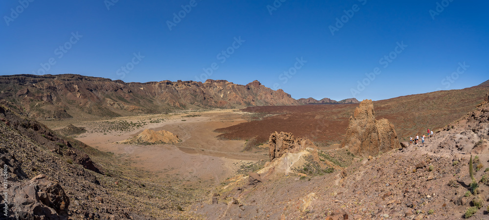 Panoramic view of the lava fields of Las Canadas caldera of Teide volcano and rock formations - Roques de Garcia. Tenerife. Canary Islands. Spain.