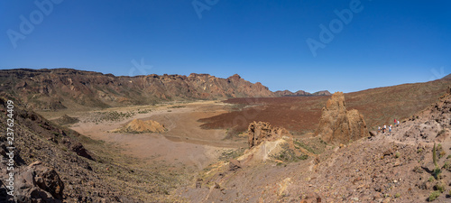 Panoramic view of the lava fields of Las Canadas caldera of Teide volcano and rock formations - Roques de Garcia. Tenerife. Canary Islands. Spain.
