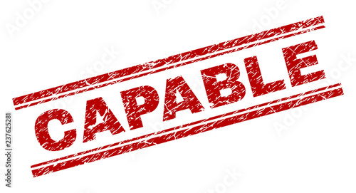 CAPABLE seal stamp with corroded effect. Red vector rubber print of CAPABLE tag with corroded texture. Text tag is placed between double parallel lines.