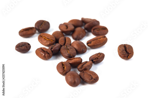 Roasted coffee beans isolated on white background. Three coffee beans