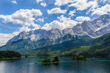 Small islands on the Eibsee, Wetterstein mountains with Zugspitze and Waxenstein in the background.