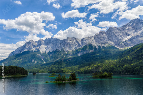 Small islands on the Eibsee, Wetterstein mountains with Zugspitze and Waxenstein in the background. © fnendzig