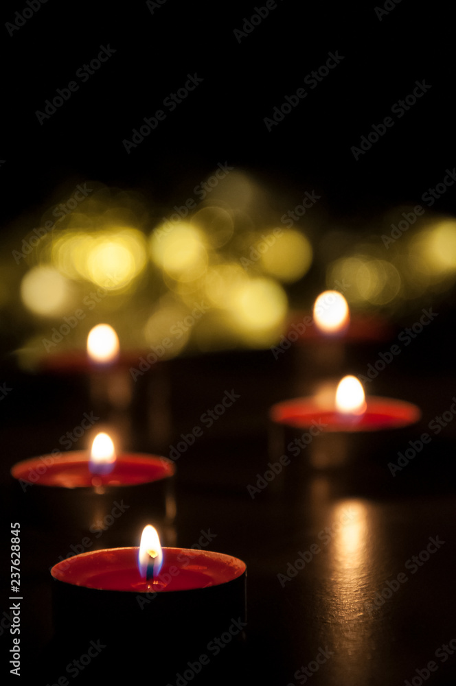 Romantic candles bokeh. Glowing candles from top.