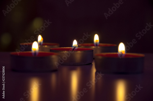 Romantic candles bokeh. Glowing candles from top.