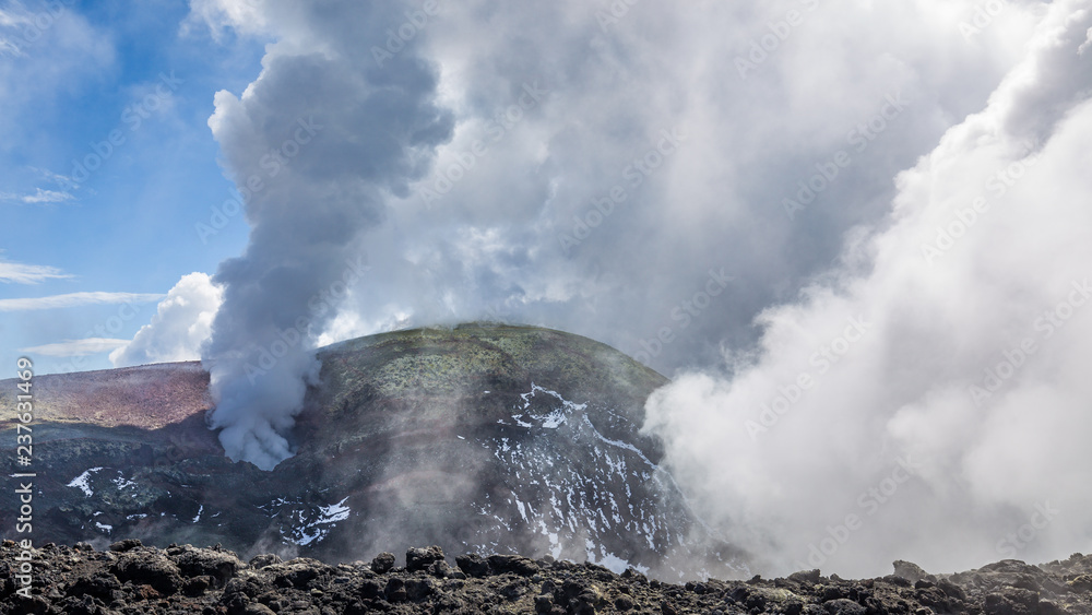 Steaming vent at mount Etna's summit crater Voragine, Sicily, Italy.