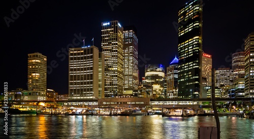 Circular quay and ferry terminal at night with city lights in Sydney, Australia on 2 October 2013
