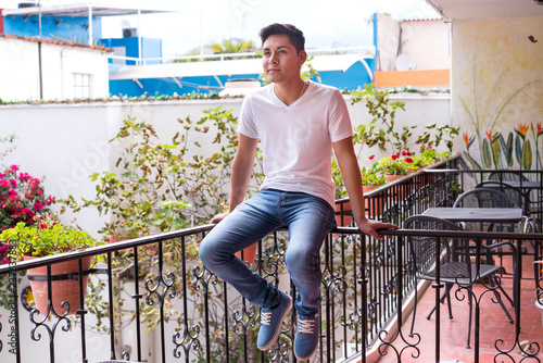 Young man sitting on terrace