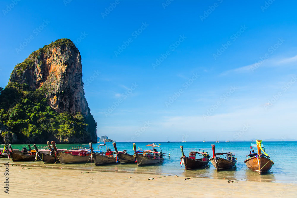 Amazing view of beautiful Ao Nang Beach with longtale boats. Location:  Krabi Province, Thailand, Andaman Sea. Artistic picture. Beauty world.