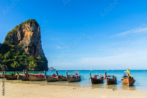 Fototapeta Naklejka Na Ścianę i Meble -  Amazing view of beautiful Ao Nang Beach with longtale boats. Location:  Krabi Province, Thailand, Andaman Sea. Artistic picture. Beauty world.