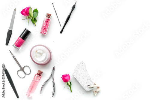 tools for manicure with spa salt and rose on white background top view mock up
