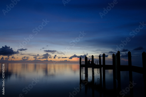 Dusk falls over the Gulf of Mexico in the Florida keys with beautiful skies and calm ocean waters
