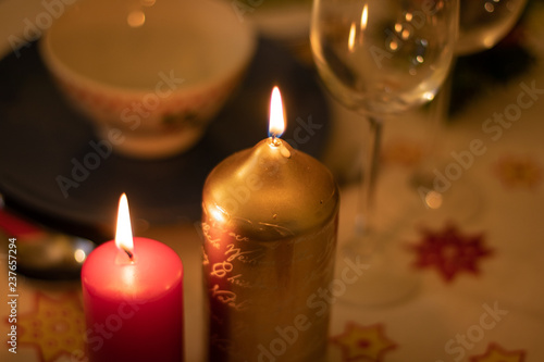 Detail of burning candles on a christmas table
