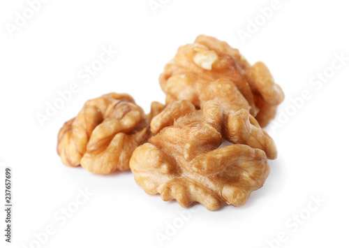 Heap of tasty walnuts on white background