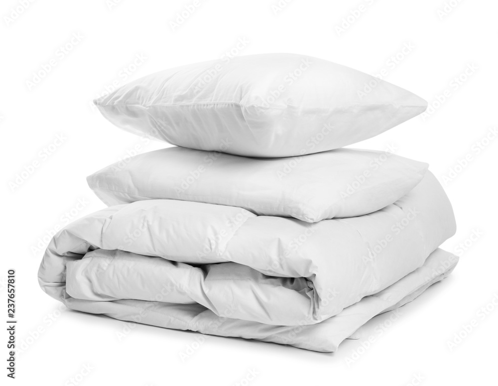 Obraz premium Clean blanket and pillows on white background