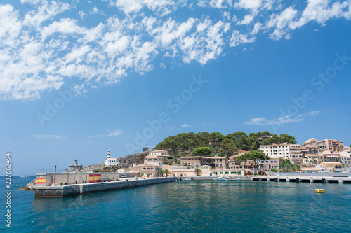 Port de Soller, Mallorca, Spain - July 19, 2013: View from the sea of the city, yachts, beach, streets, hotels. © Nikolay Denisov