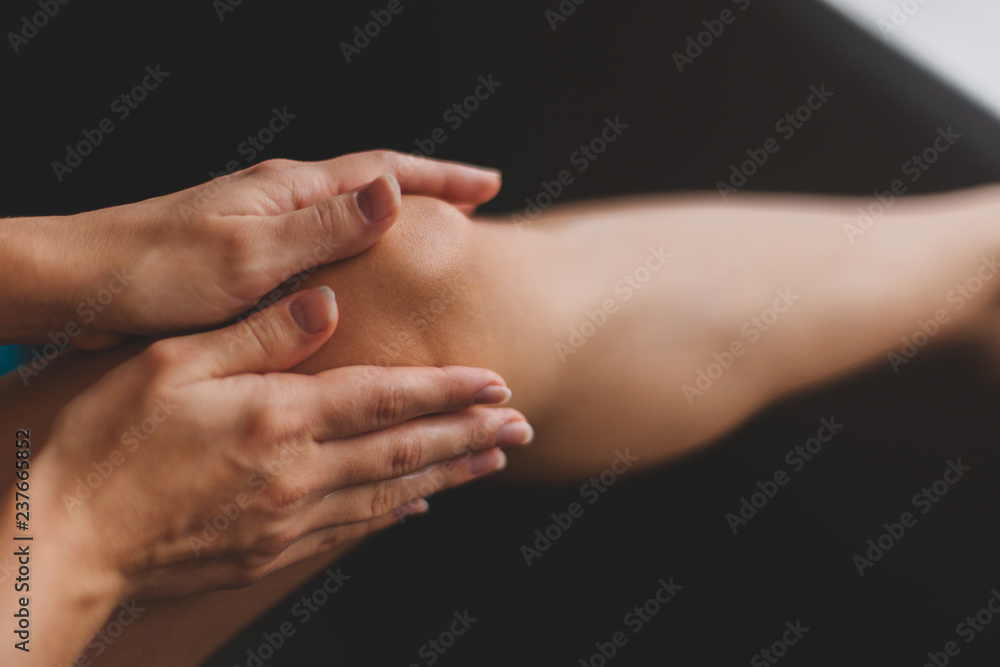 Young woman smearing cream on her leg. Epilation concept. Sexy Young woman smearing cream on her leg. Epilation concept. Sexy