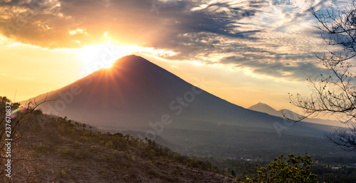 Panoramic beautiful view view of the mountains at sunset. evening cloudy view of the volcano Аgung, Bali