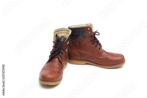 Male brown leather boot, footwear fashion isolated on white background. © pookpiik