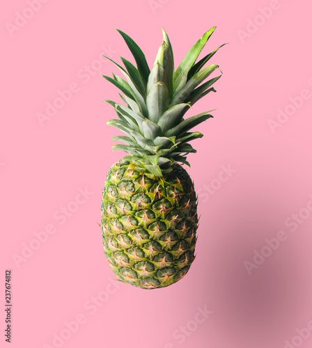 Minimalistic fruit concept. Pineapple isolated on pastel background. Photo with a shadow..