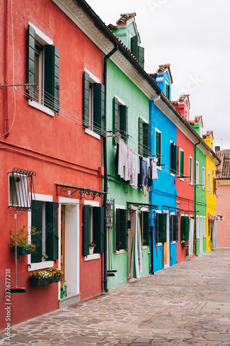 Row of colorful houses in Burano, Venice, Italy © jonbilous
