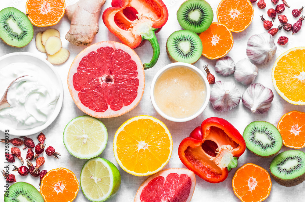 Immunity boosting food set on a light background . Healthy lifestyle concept, winter prevention of colds. Flat lay, top view Immunity boosting food set on a light background . Healthy lifestyle concept, winter prevention of colds. Flat lay, top view