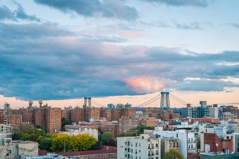 View of the Williamsburg Bridge and East Village at sunset, in Manhattan, New York City
