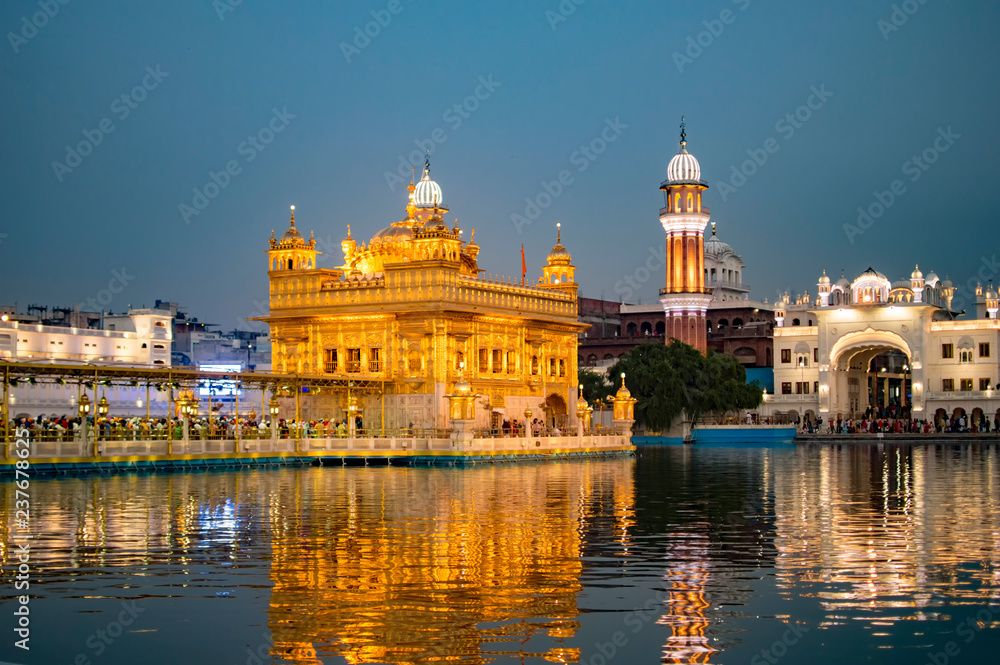 Clear reflection of golden temple in the holy waters