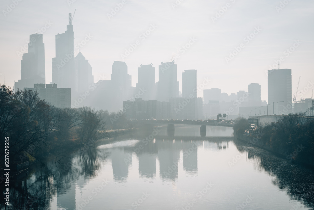 The Philadelphia skyline in fog and Schuylkill River in Philadelphia, Pennsylvania.