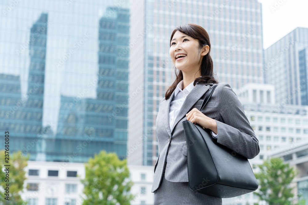 portrait of young asian business person standing in
front of building portrait of young asian business person standing in
front of building
