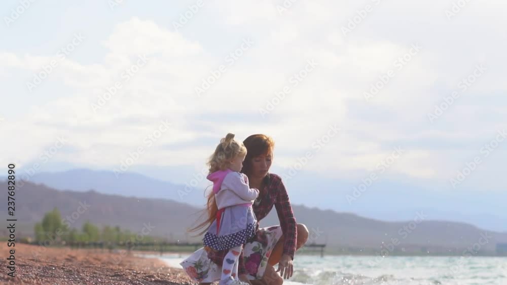 mother and daughter by the sea mother and daughter by the sea