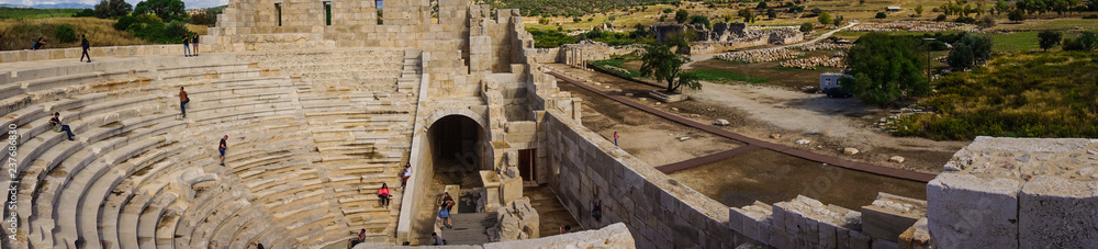 Kas, Antalya/Turkey - October 28, 2017 Panoramic view of Bouleuterion in Patara (Pttra) Ancient City. The assembly hall of Lycia public. The Lycian League's capital was at Patara. Kas, Antalya/Turkey - October 28, 2017 Panoramic view of Bouleuterion in Patara (Pttra) Ancient City. The assembly hall of Lycia public. The Lycian League's capital was at Patara.