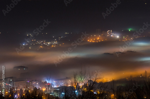 City under a thick fog shot from above