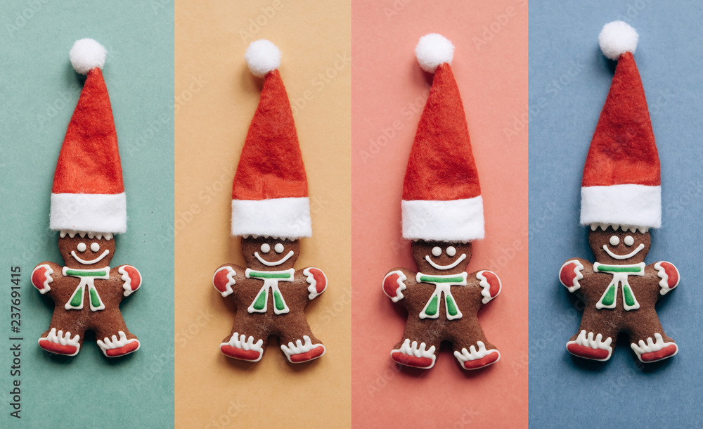 Set of Christmas gingerbread in the form of little ginger men in a red hat on colorful backgrounds. Christmas or New Year concept in minimal style. Minimalism
