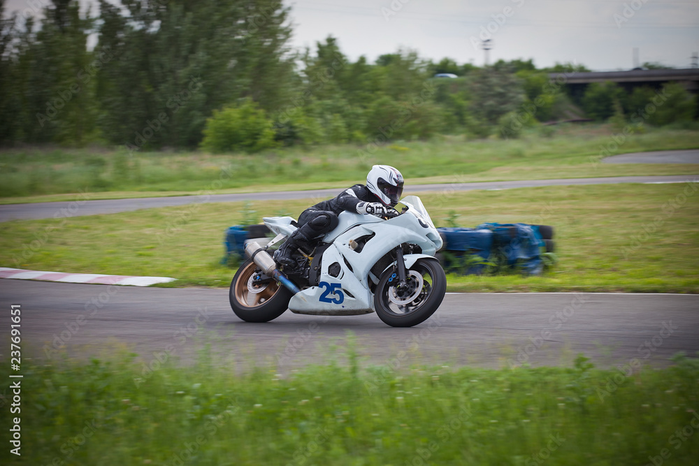 Moto-athlete on the racetrack.