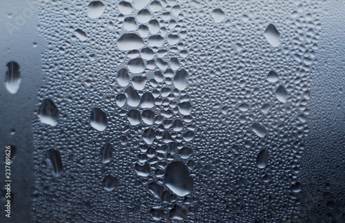 texture of wet drops on the glass. thaw
