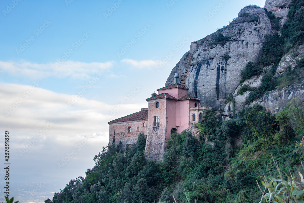 Santa Cova Chapel on the cliff of Monterrat Abbey mountain, near Barcelona, Spain