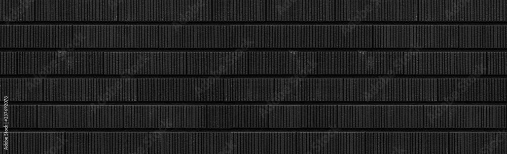 Fototapeta premium Panorama of Modern black stone tile wall pattern and background