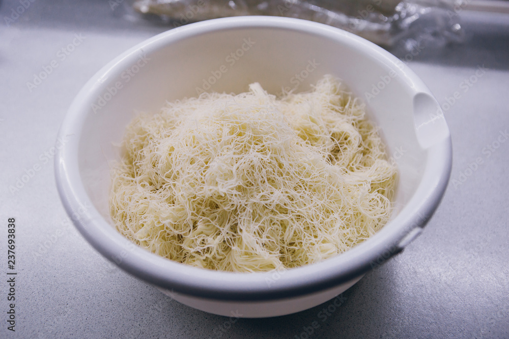 Home cooking Kunefe, the dough for Kunefe - kadayif. Home cooking Kunefe, the dough for Kunefe - kadayif.