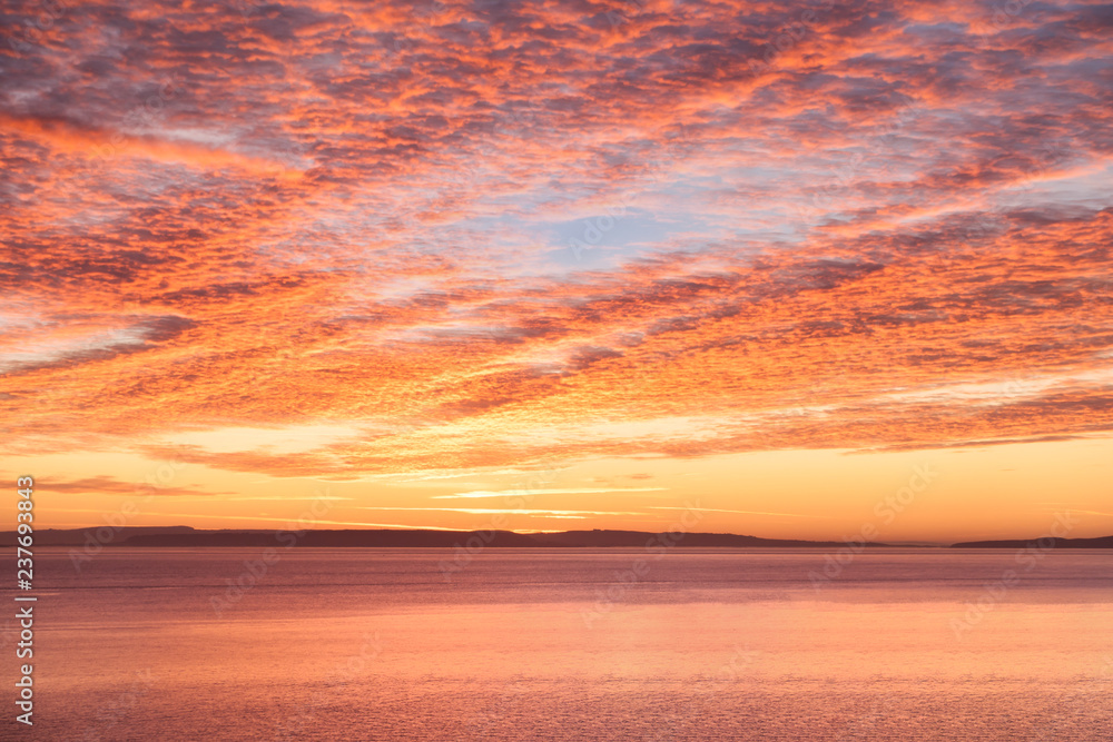 Fototapeta premium Sunrise Mackeral Sky with Cirrocumulus Clouds over the Sea