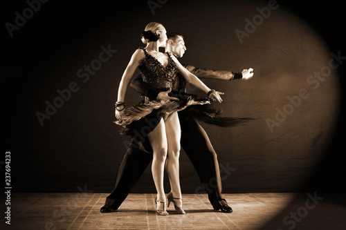 Fototapeta Naklejka Na Ścianę i Meble -  dancers in ballroom isolated on black background