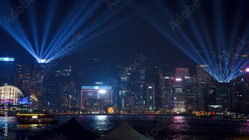 Photos View Night of Symphony of Lights and two boat of life at Victoria Harbor in Hong Kong
